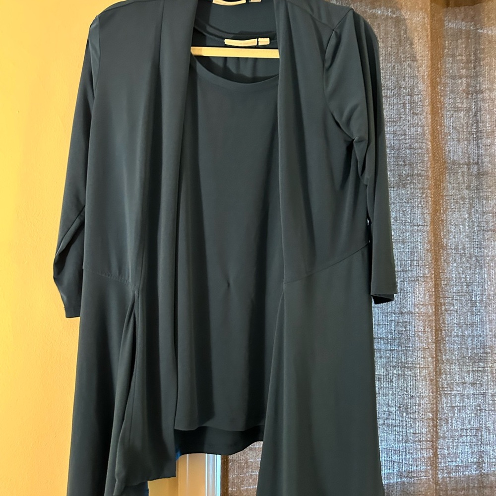 Teal blue in color. Worn 2-3 times. Great condition, smoke free home. 2 piece